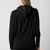 Image showing the back of a JOOLA Women's Ribbed Jacket showing the hood, black.