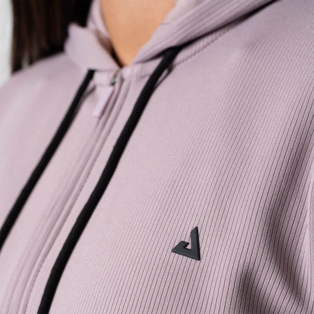 Close up image of the JOOLA Women's Ribbed Jacket highlighting the JOOLA Trinity logo over the left chest.