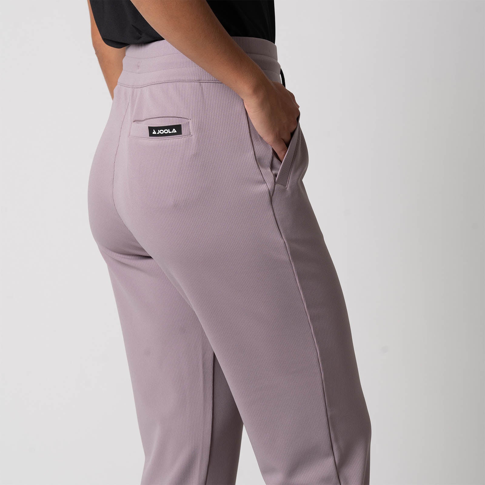 Image showing the back pocket and JOOLA logo on a pair of JOOLA Women's Ribbed Joggers, Dusty Mauve.