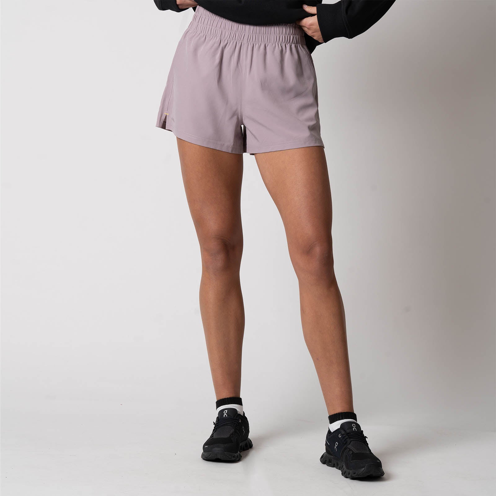 Image showing a female model wearing a pair of JOOLA Women's Woven Shorts, Dusty Mauve.