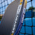 Close up image showing the detailed design and blue/gold colorward on the side of a JOOLA Agassi Pro V pickleball paddle.