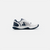 White background, product image shoting the outside of a right footed JOOLA Men's R4LLy Pickleball shoe, navy blue and white.