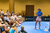 Image of Simone Jardim teaching a Pickleball clinic to a large group.