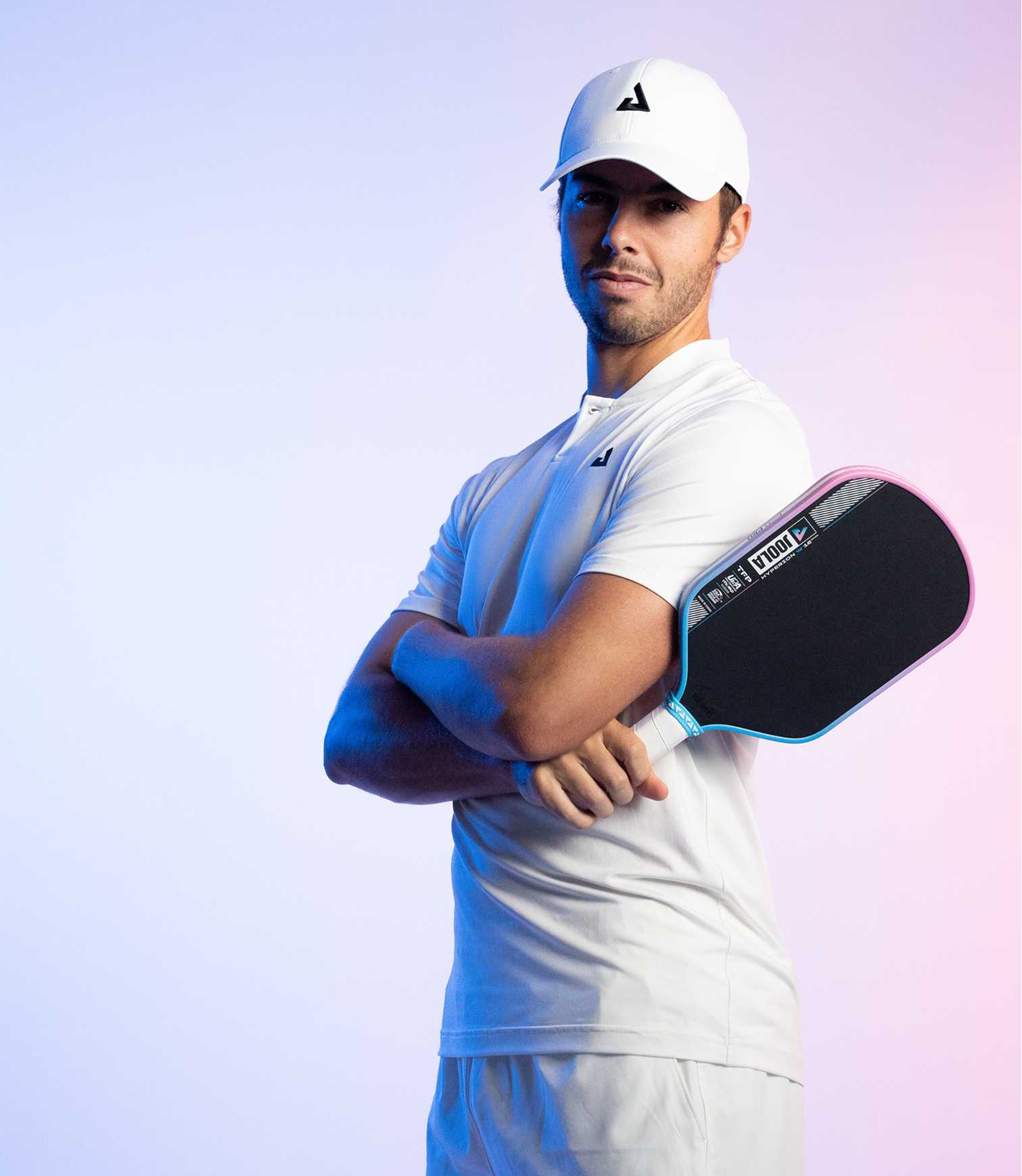 Image of JOOLA Pro Ben Johns holding a JOOLA Hyperion Pro IV with blue and pink gradient edge guard.