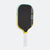 Pickleball paddle with black face, yellow sides, and white handle on a white background.