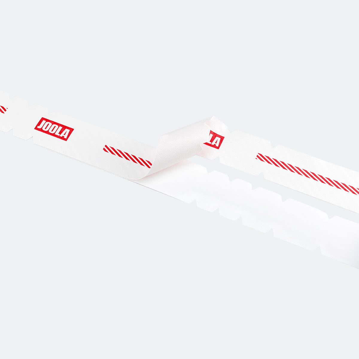 White background, close up image of an unrolled roll of JOOLA Pro IV edge guard tape.