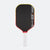 Pickleball paddle with black face, red rim, and white handle on a white background