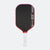 Pickleball paddle with black face, red rim, and white handle on a white background