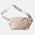 Beige JOOLA Belt bag with a strap on a white background