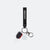 Graf keychain with paddle and white ball charm on a white background