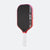 Pickleball paddle with red rim and white handle on a white background