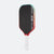 Pickleball paddle with black face, red border, and white handle on a white background