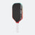 Pickleball paddle with black surface, red edges, and white handle on a white background