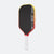 Pickleball paddle with black face, red sides, and white handle on a white background
