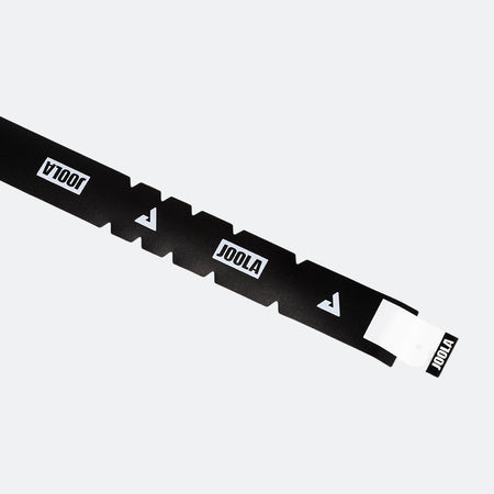A black and white strip of JOOLA Protective Edge Guard Shape.