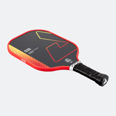 White background, product image of a red JOOLA Essentials Dash pickleball paddle.