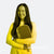 Anna Bright holding a pickleball paddle with 'Scorpeus' branding and 'Anna Bright' signature on a yellow and black gradient background.