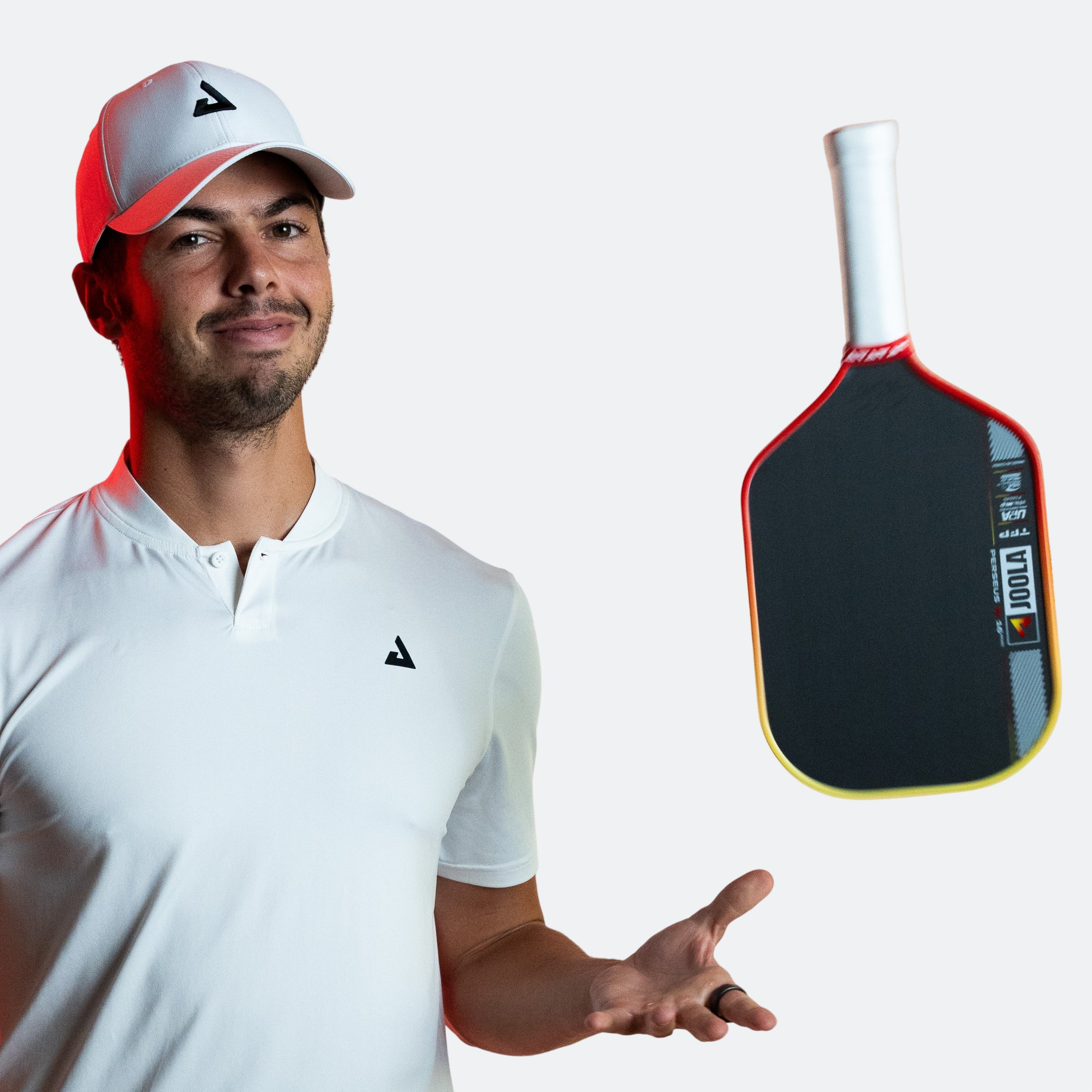 JOOLA Pro Ben Johns tossing his Perseus Pro IV in the air.