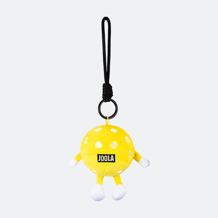 Image of the back of a JOOLA Pickleball plushie hanging from a loop.