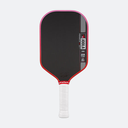 Pickleball paddle with black surface, red edges, and white handle on a white background