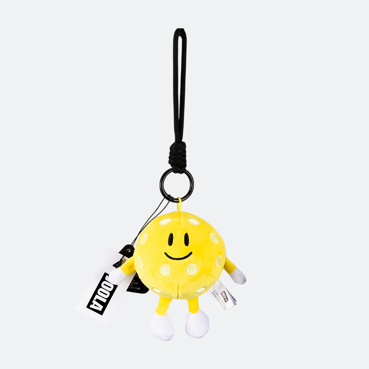 Image of a yellow JOOLA Pickleball plushie with a JOOLA tag.