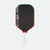 Pickleball paddle with black surface, red border, and white handle on a white background
