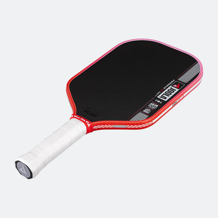 Pickleball paddle with red frame and black surface on a white background