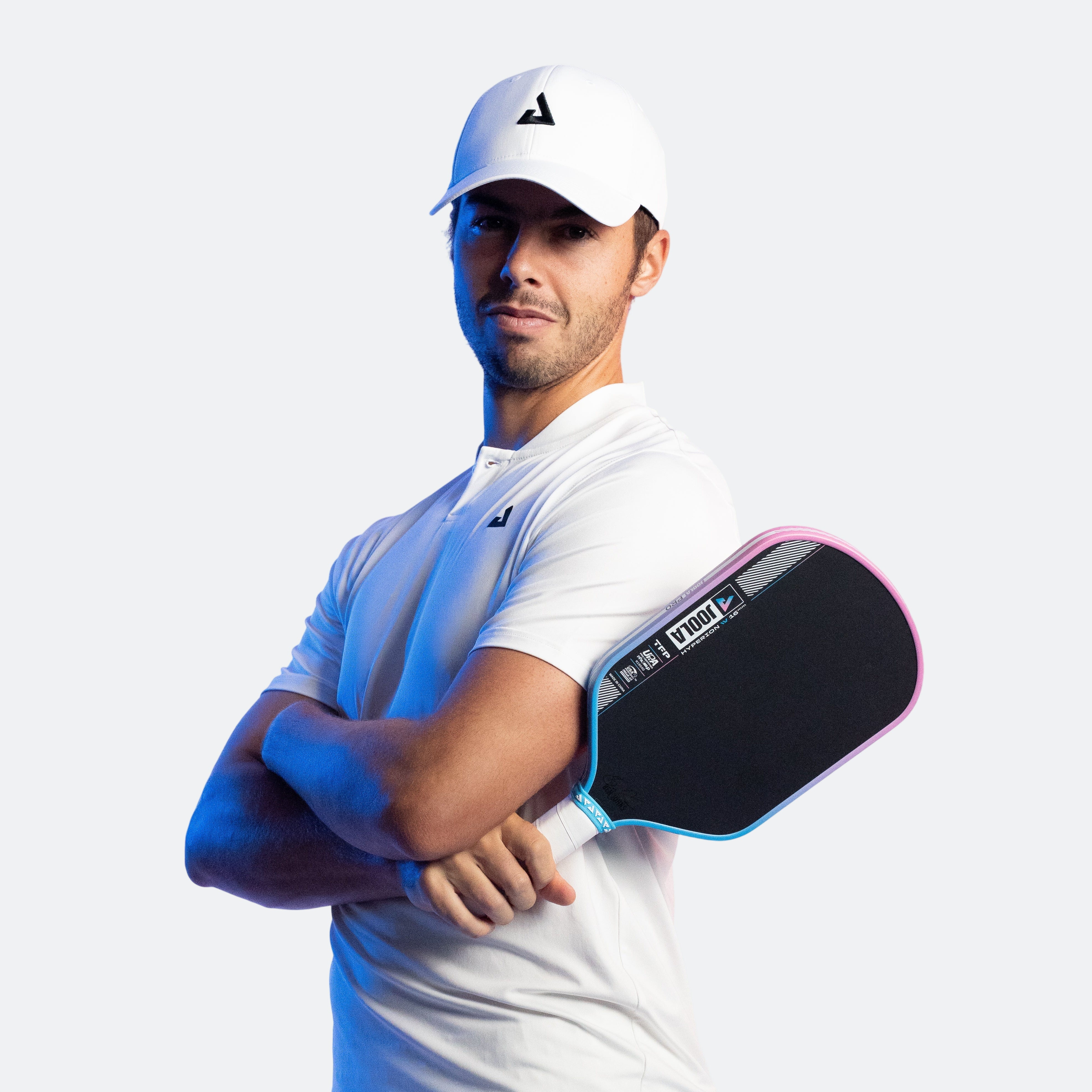 Image of JOOLA Pro Ben Johns arms crossed holding a JOOLA Hyperion Pro IV.