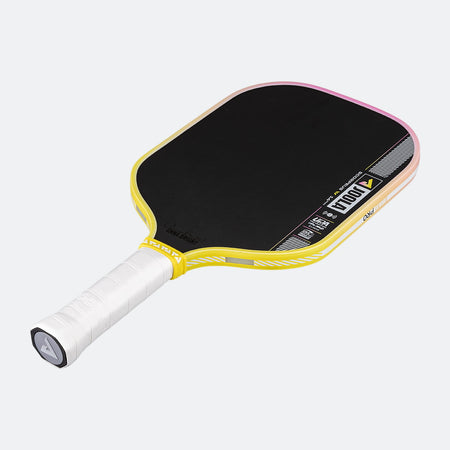 Pickleball paddle with black playing surface, yellow frame, and white handle on a white background.