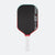Pickleball paddle with black face, red rim, and white handle on a white background