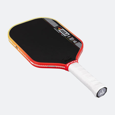 Pickleball paddle with black surface, red frame, and white handle on a white background