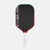 Pickleball paddle with black face, red edges, and white handle on a white background