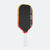 Pickleball paddle with black surface, red and yellow edges, and white handle on a white background