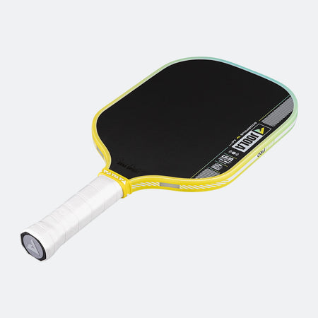 Pickleball paddle with black surface and yellow frame on a white background.