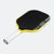 Pickleball paddle with black surface and yellow frame on a white background.