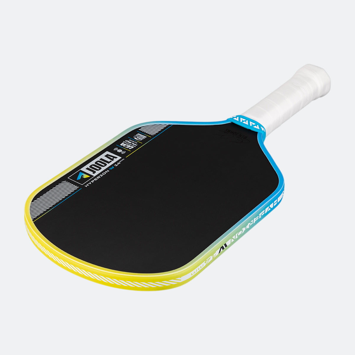 Pickleball paddle with black surface, yellow rim, and white handle on a white background.