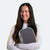 Yellow and green background, image of JOOLA Pro Anna Bright clutching a Scorpeus Pro IV in her hands.