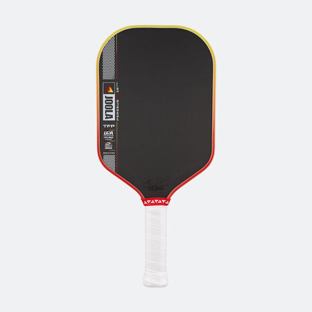 Pickleball paddle with black surface, red border, and white handle on a white background