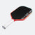 Red and black pickleball paddle on a white background