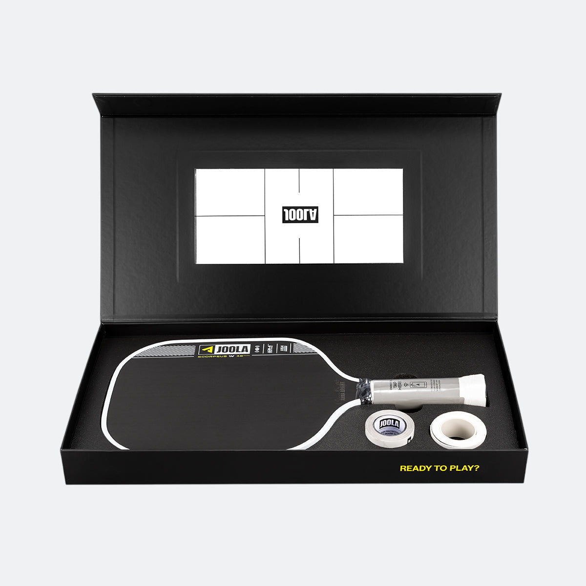 Pickleball paddle and ball set in a black box with a visible brand logo.