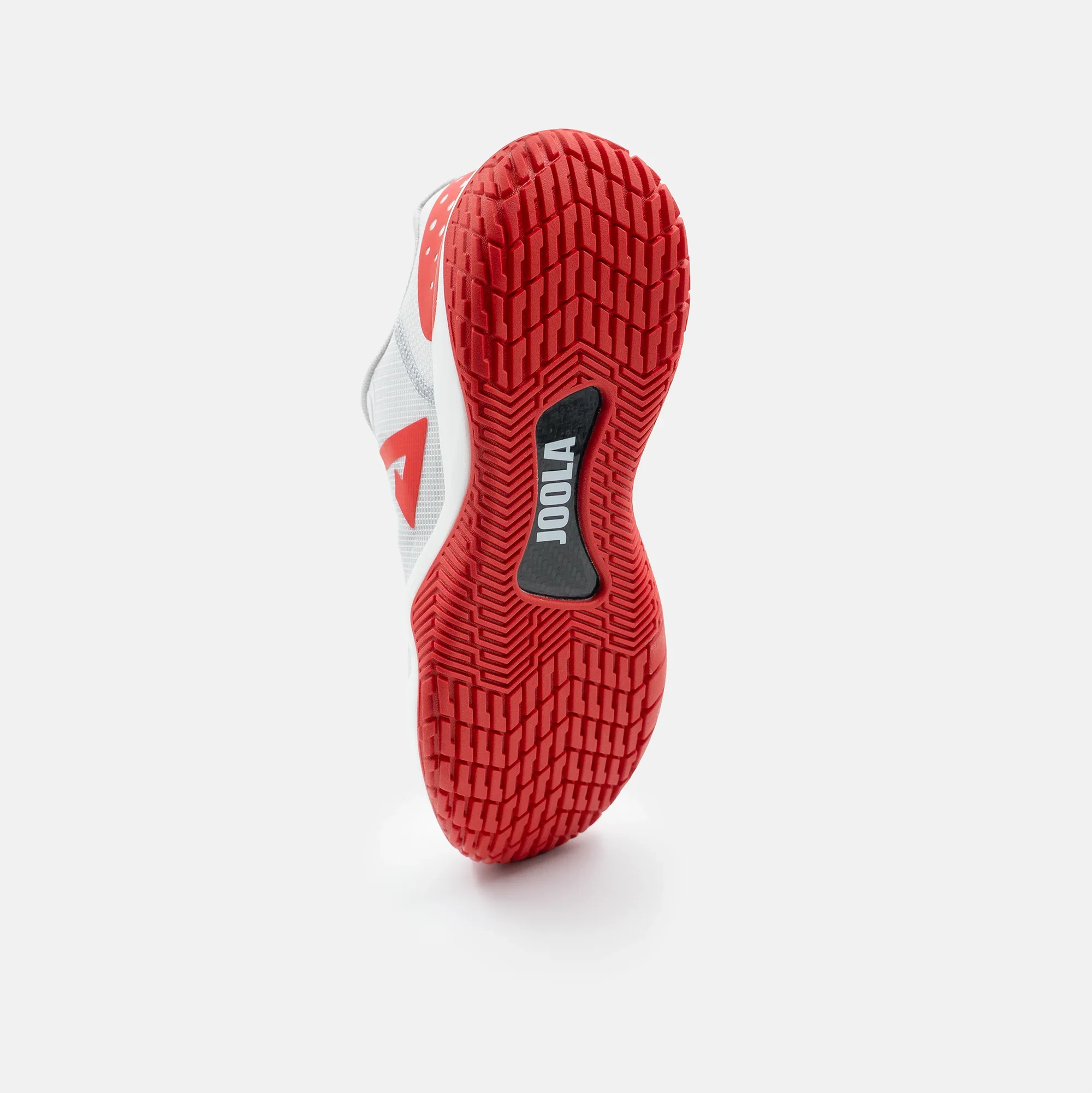 White background, product image of the JOOLA Women's R4LLy pickleball shoe in red and white colorway. Image shows the bottom tred and carbon fiber shank on the bottom of the shoe.