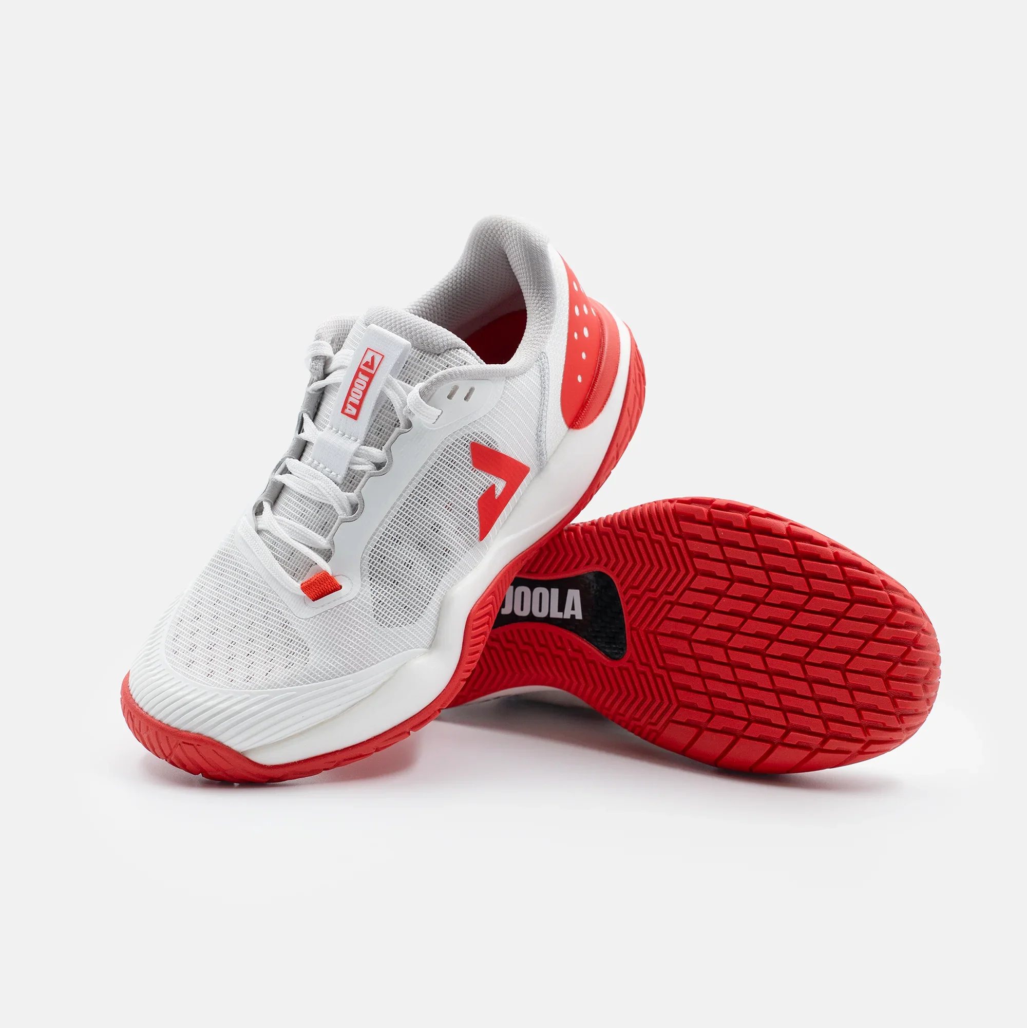 White background, stylized image of a pair of JOOLA R4LLy women's pickleball shoes, red and white colorway.